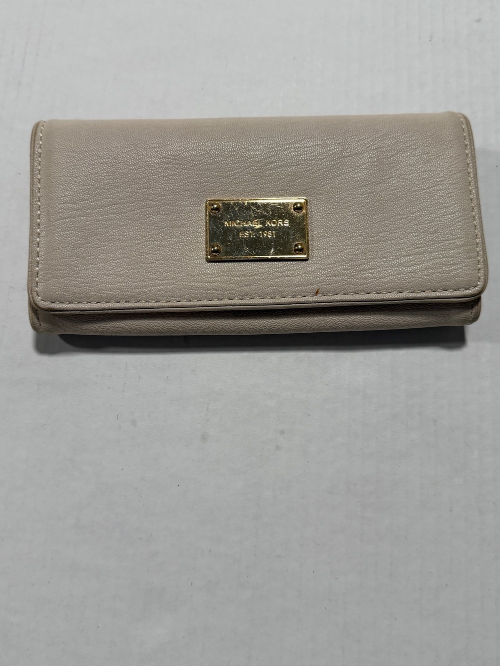 Michael Kors Cream Leather Trifold Wallet with Gold Plaque